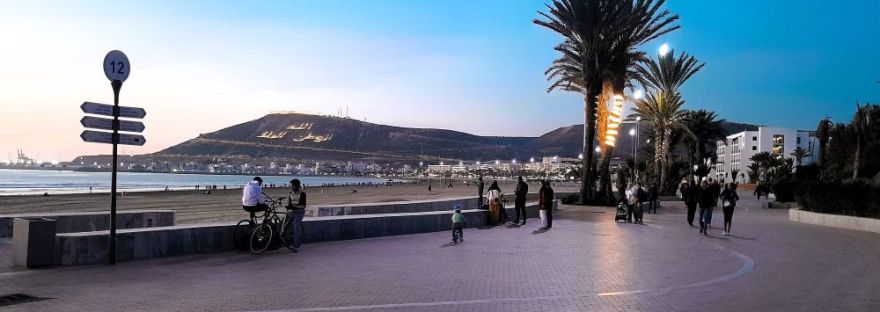 Agadir Promenade by night with Kasbah in background